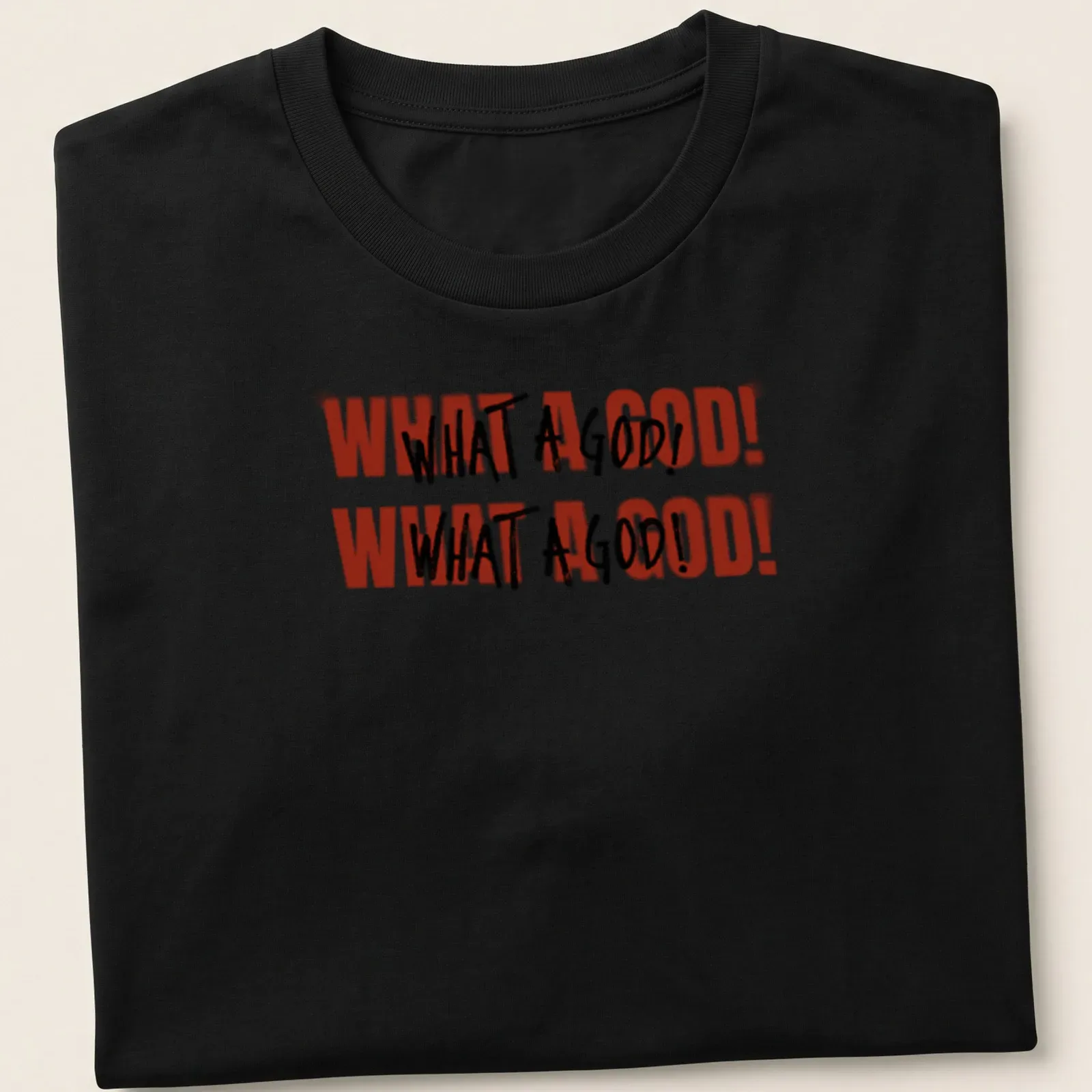 Bold text graphic tee featuring 'WHAT A GOD! WHAT A GOD!' in red, black, and white — printed on a unisex t-shirt