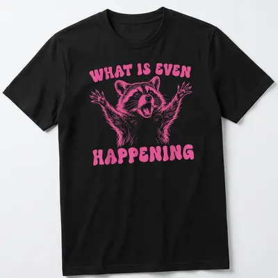 Vintage-style pink t-shirt featuring a quirky raccoon and humorous text