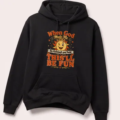 Vibrant cartoon sun with halo and a joyful quote about fun — printed on a unisex hoodie