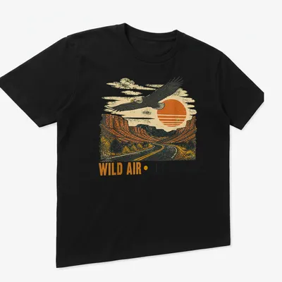 Retro design featuring an eagle soaring over a landscape with vintage colors — printed on a unisex t-shirt (angled view)