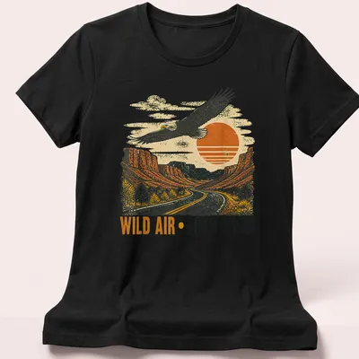 Retro design featuring an eagle soaring over a landscape with vintage colors — printed on a women's shirt