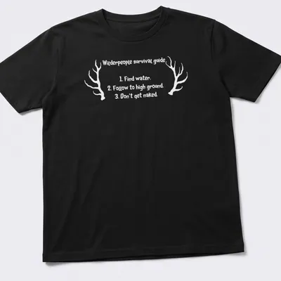 Vintage style shirt with antlers and humorous survival tips printed in black and white — printed on a unisex t-shirt