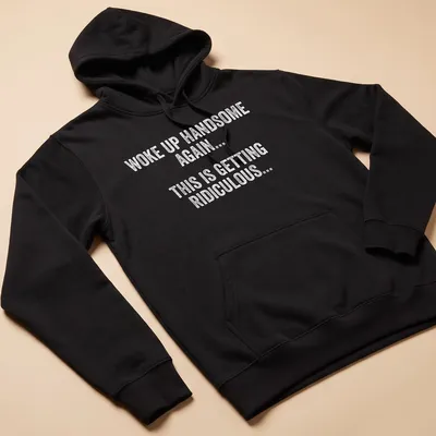 Funny Woke Up Handsome Again text t-shirt in playful typography — printed on a unisex hoodie