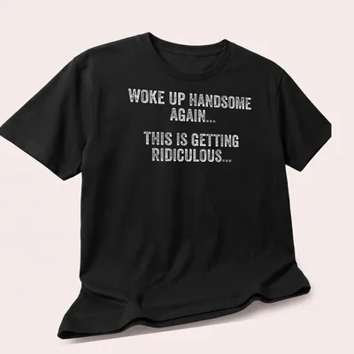 Funny Woke Up Handsome Again text t-shirt in playful typography — printed on a unisex t-shirt (angled view)