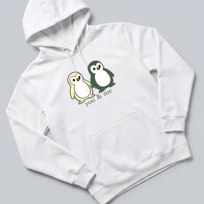Cute cartoon of two penguins holding flippers with text above. — printed on a unisex hoodie