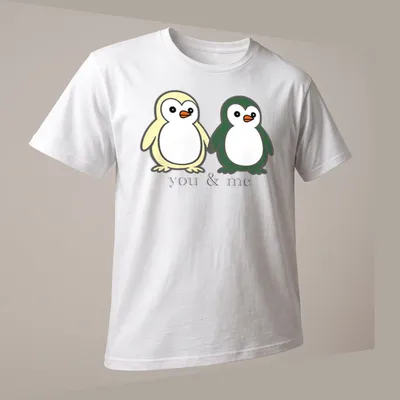 Cute cartoon of two penguins holding flippers with text above. — printed on a unisex t-shirt (angled view)