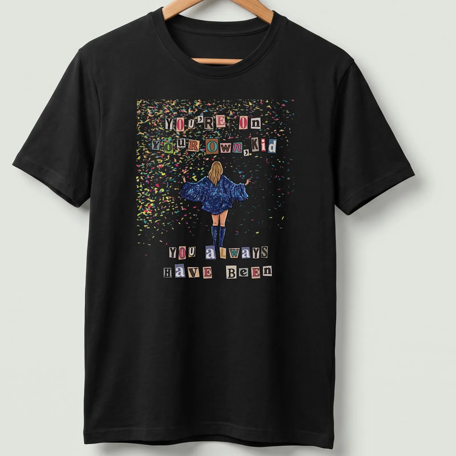 Colorful confetti design with sparkly text: You're On Your Own, Kid — printed on a unisex t-shirt